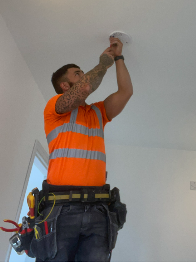 Smoke alarm installation in progress